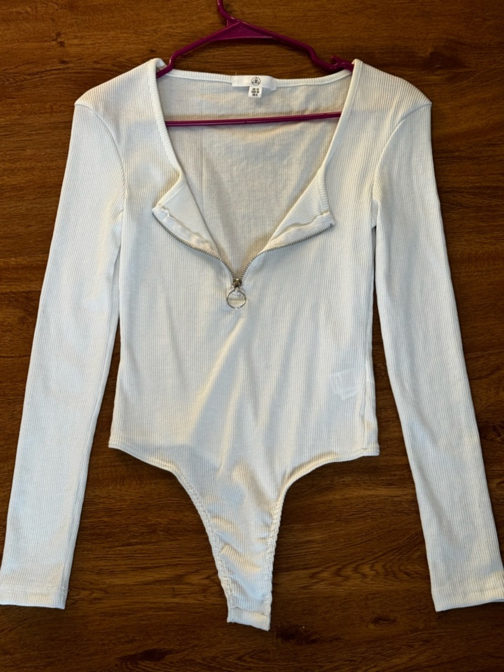 White Ribbed Long Sleeve Snap Bodysuit With Front Ring Zip Detailing